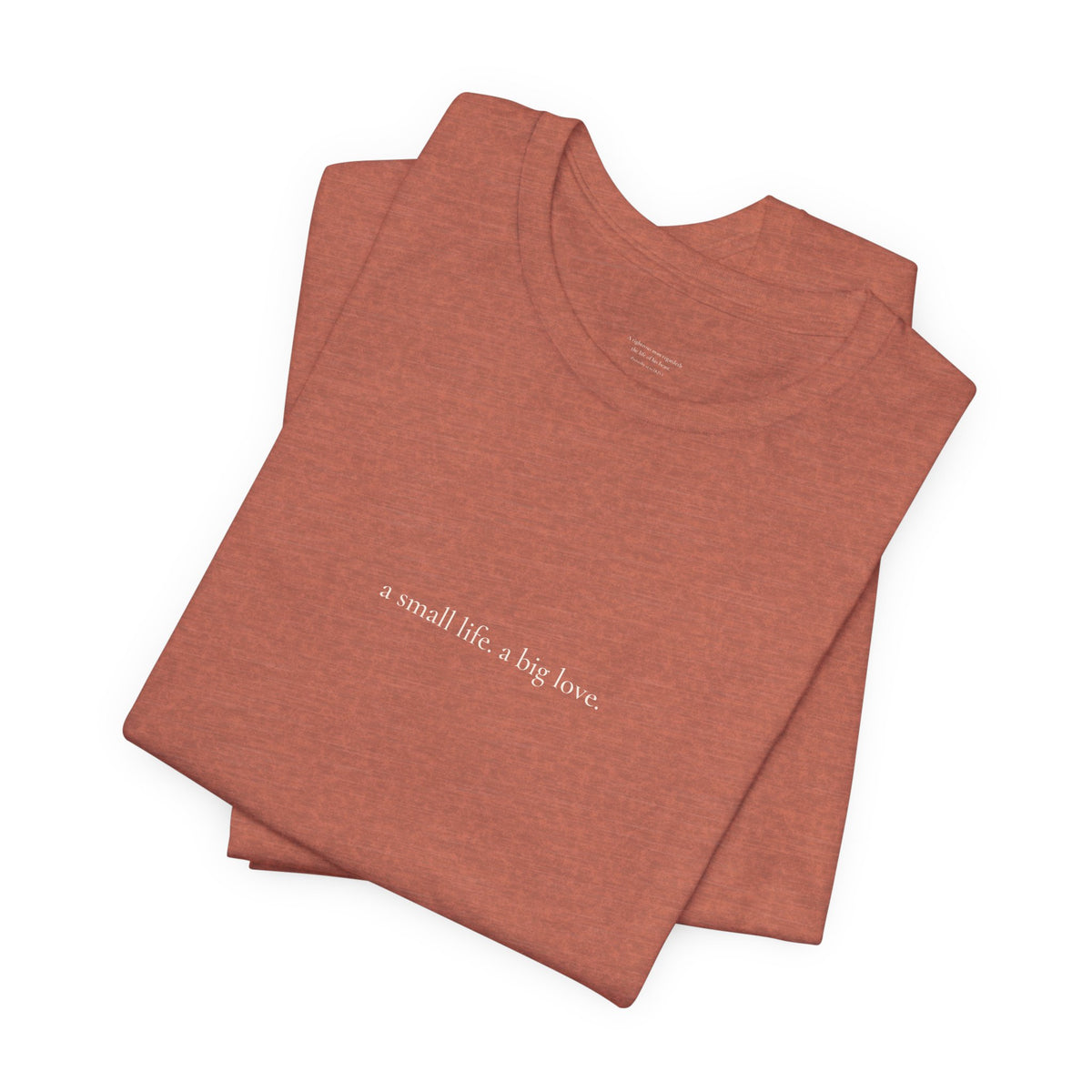 a small life. a big love. tee in Heather Clay, folded