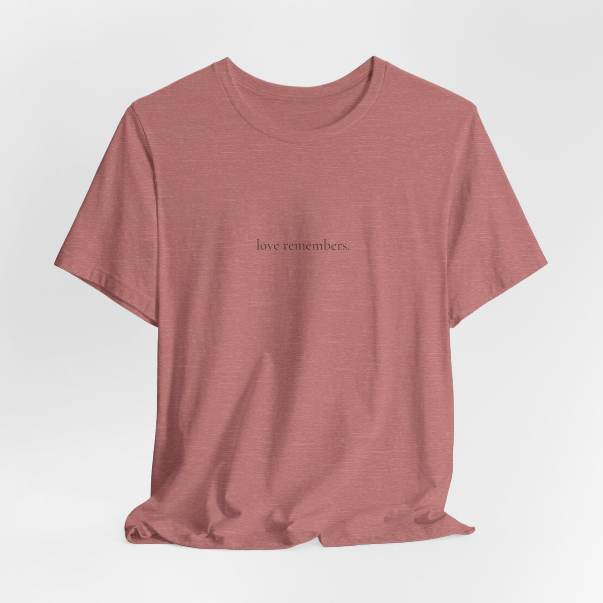 love remembers. tee in Heather Mauve, on a hanger