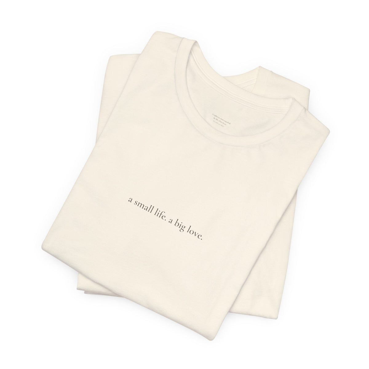 a small life. a big love. tee in Natural, folded