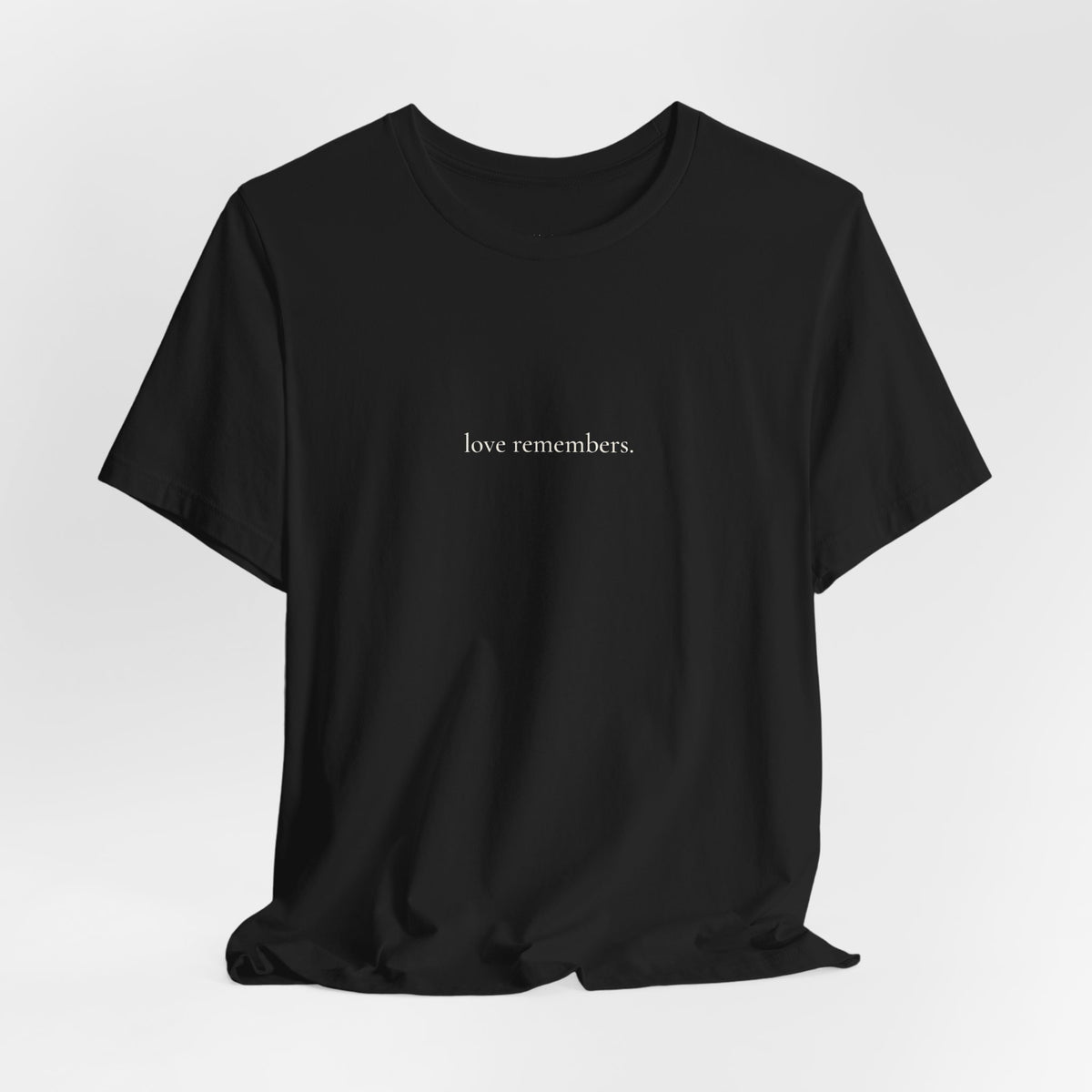 love remembers. tee in Black, on a hanger