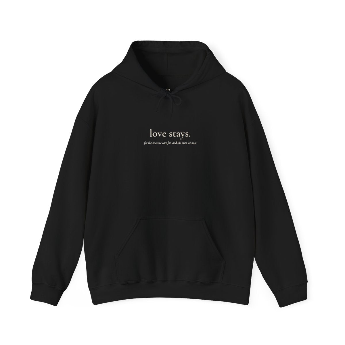 Print mockup of the black love stays. hoodie with small cream serif type on the chest