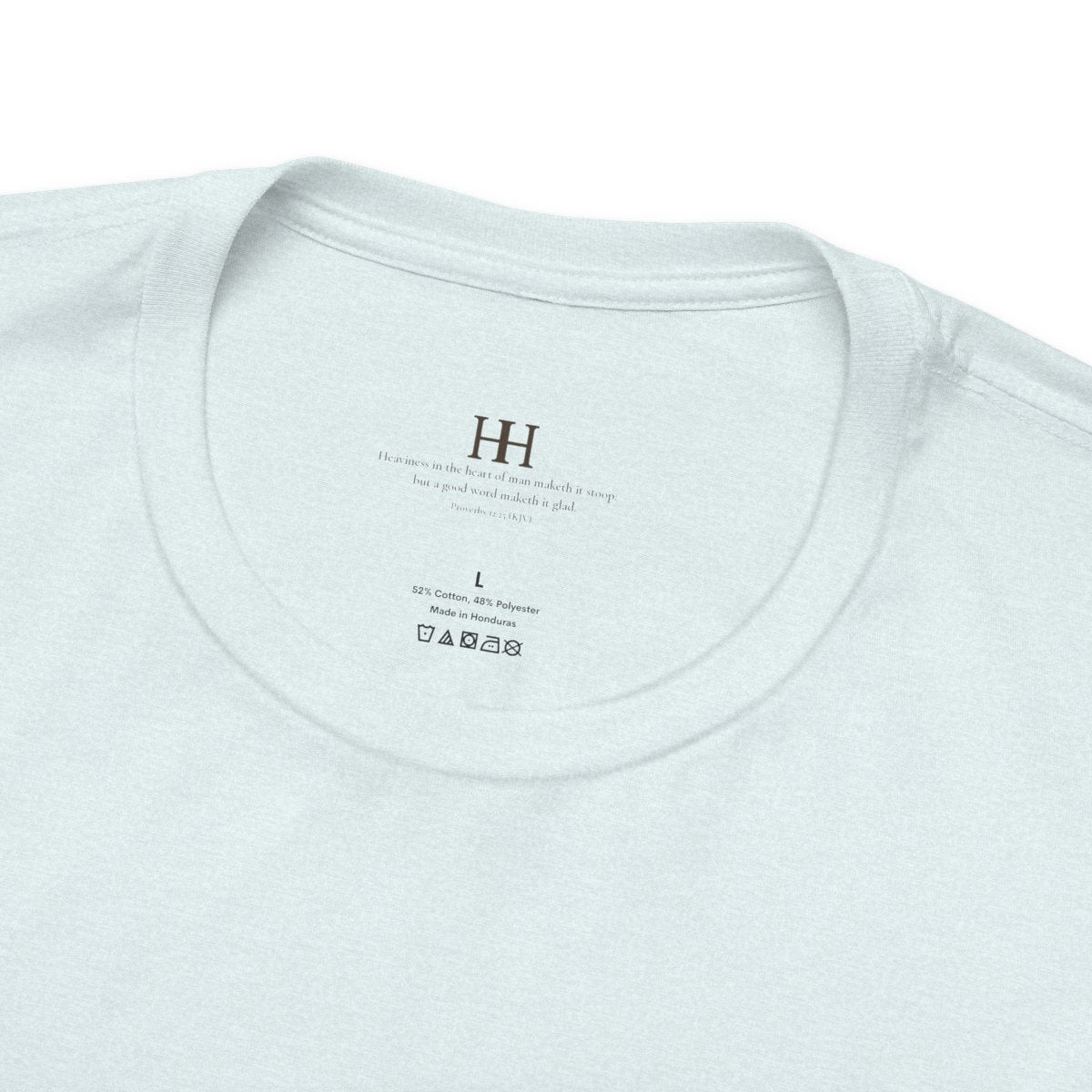 love remembers. tee in Heather Ice Blue, inside collar printed with a small HH mark above Proverbs 12:25