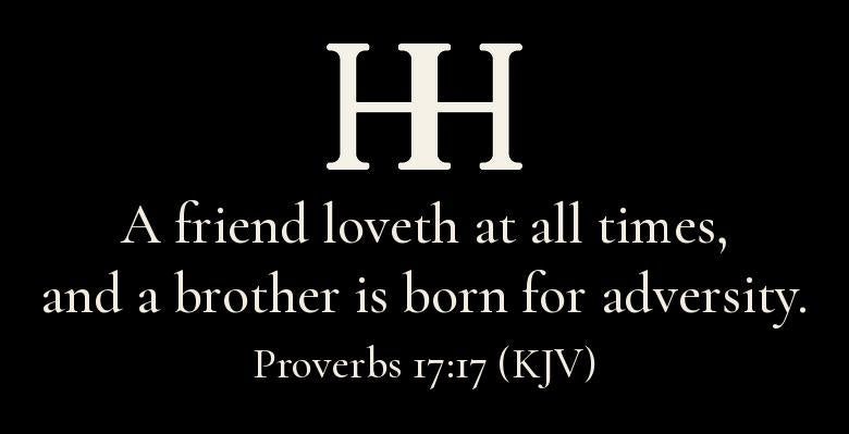 Collar detail: a small HH monogram over the verse “A friend loveth at all times, and a brother is born for adversity. Proverbs 17:17 (KJV)” in cream type, printed inside the back neck. Print-file preview, not a photo.