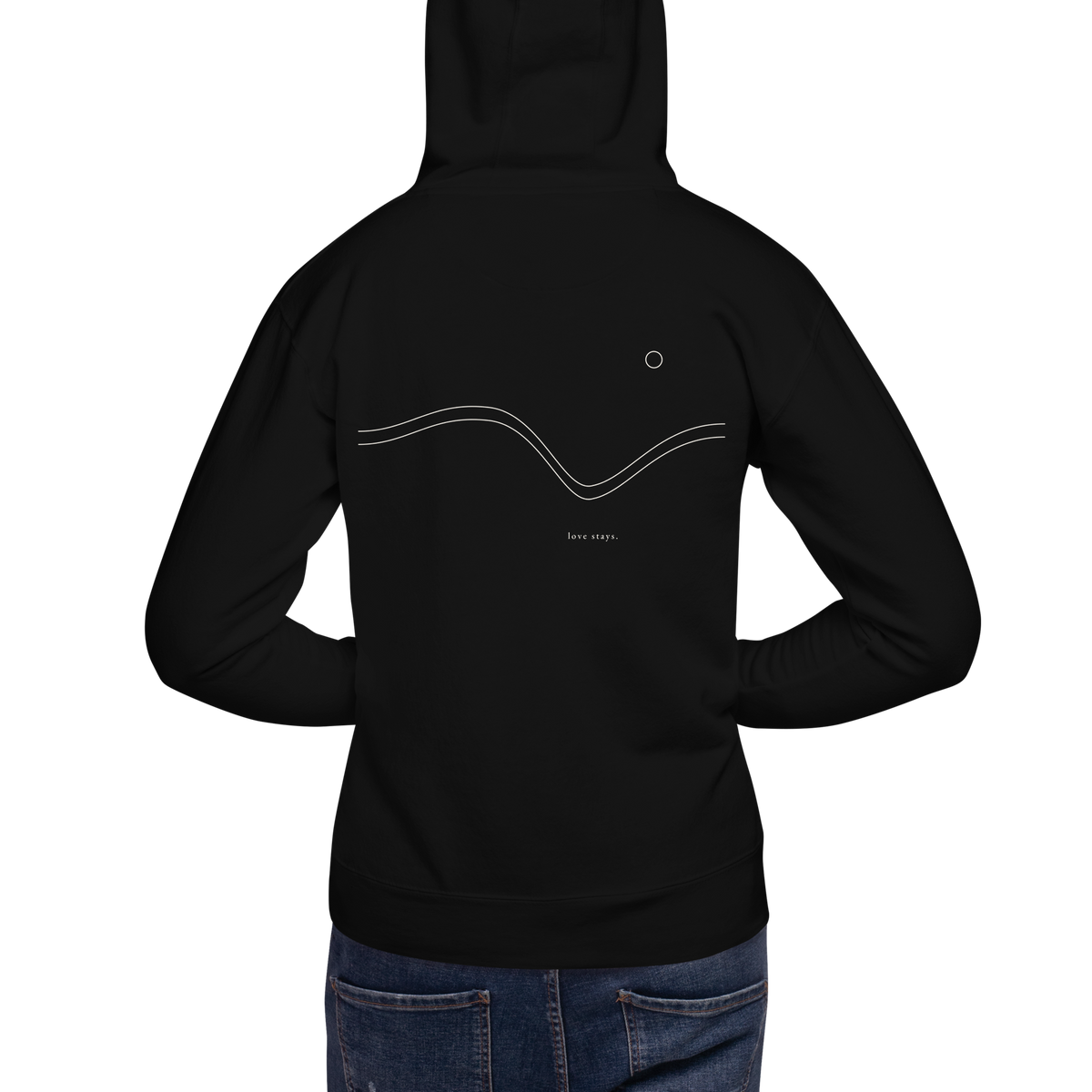 Person wearing the black love stays. The Held Line Hoodie, back view showing the cream Held Line drawing of two lines through a valley