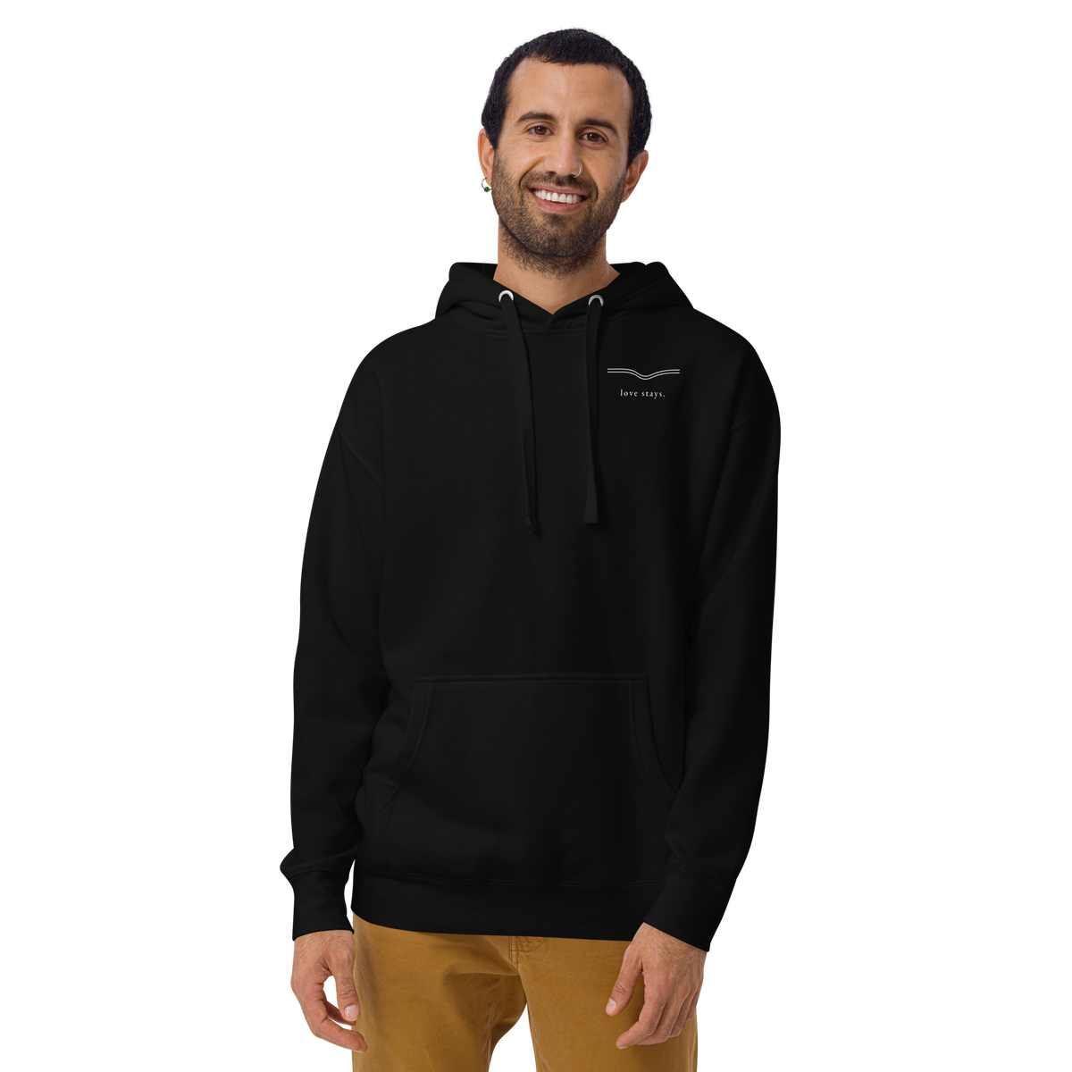 Person wearing the black love stays. The Held Line Hoodie, front view with a small cream line and love stays. on the left chest